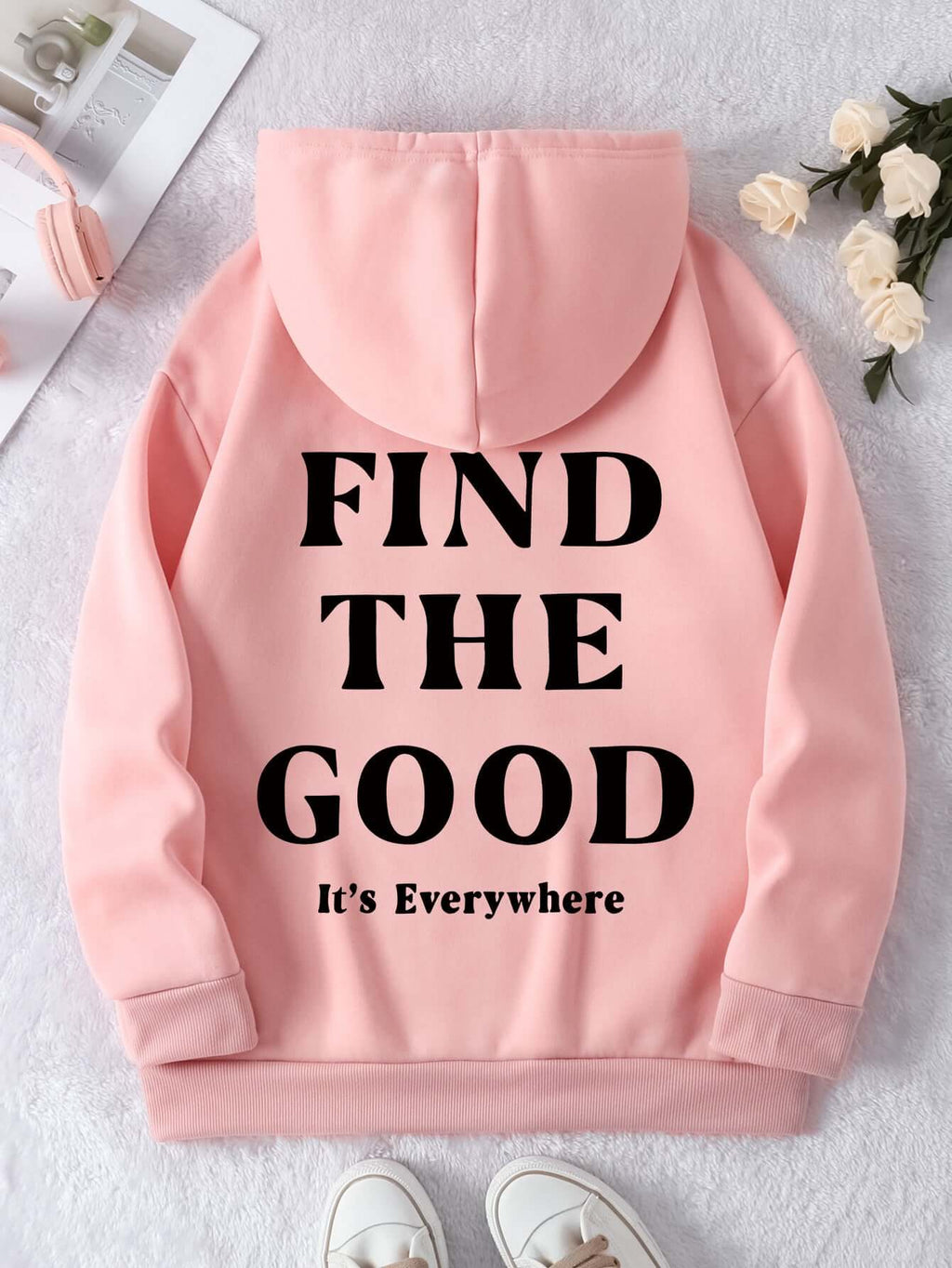 Brushed hoodie in pink with black text 'FIND THE GOOD It's Everywhere' on the back, stylish and comfy for casual wear.