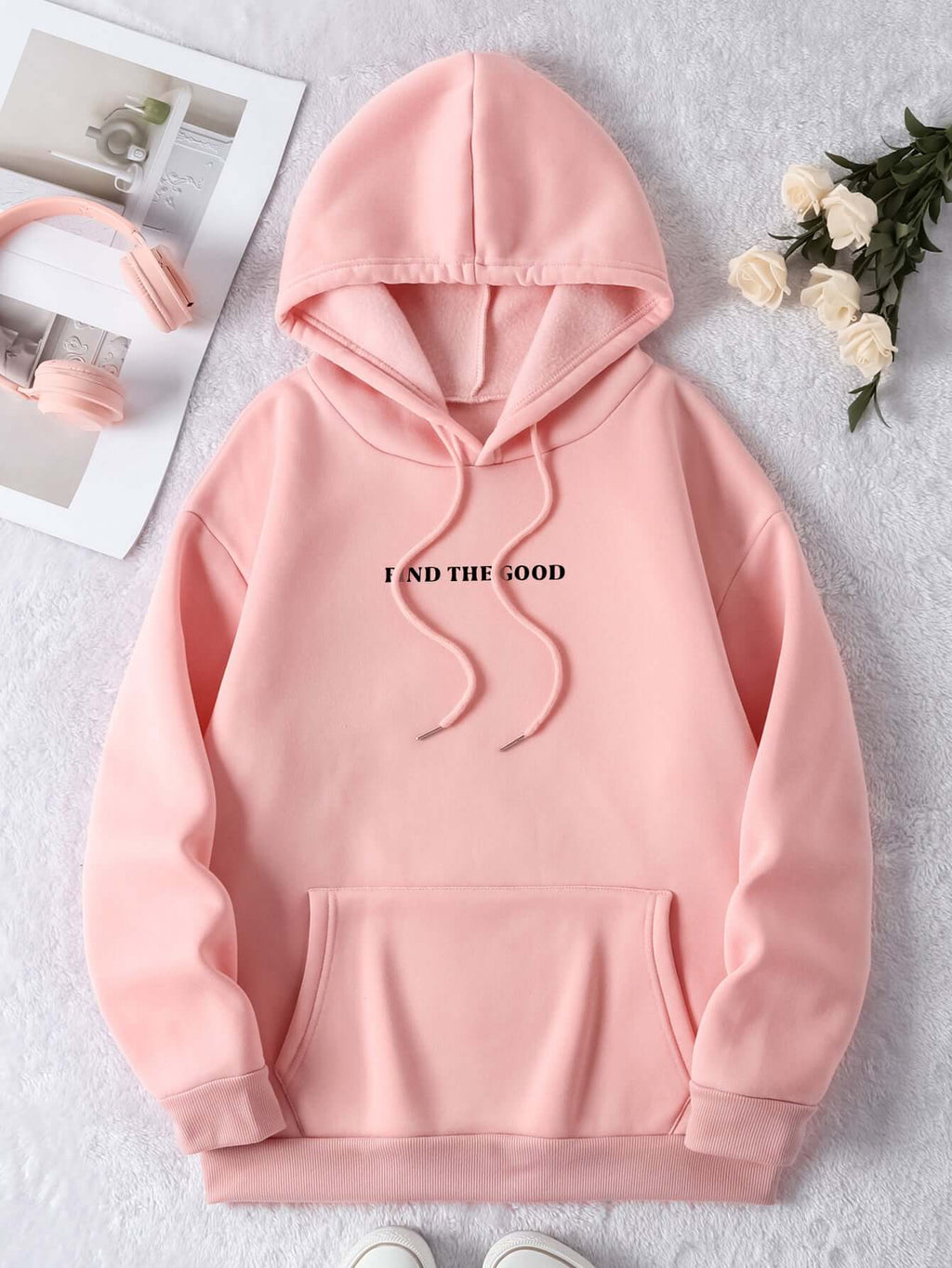 Brushed hoodie in pink color with a printed text design, ideal for casual and comfortable wear.